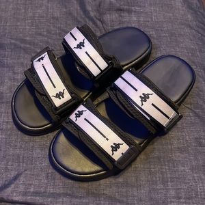 Brand is Kappa, color is black and white, slides.
